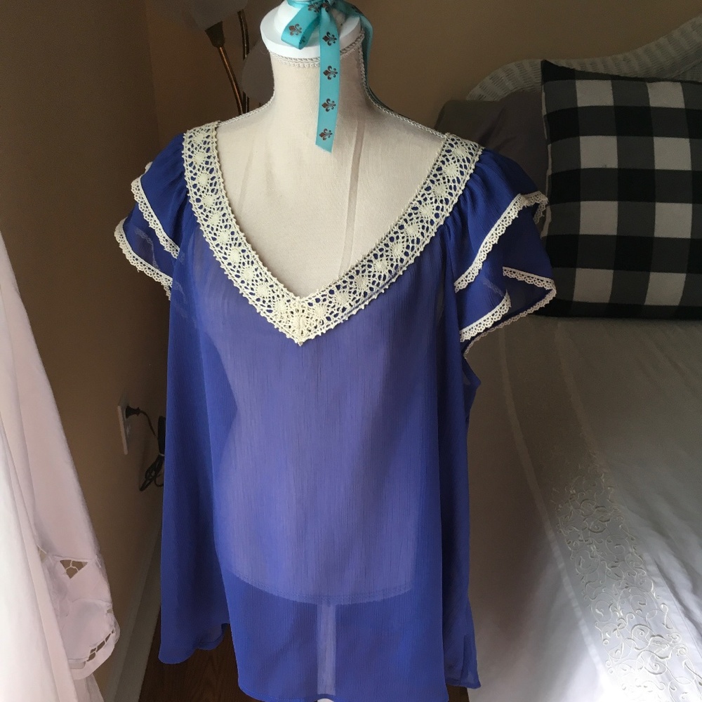 Purple poly blouse with beige crochet neckline and hem